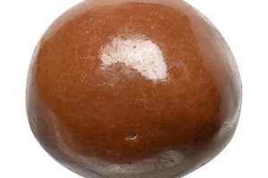 Round chocolate candy on isolated background, a Food & Drink Photo by ndanko