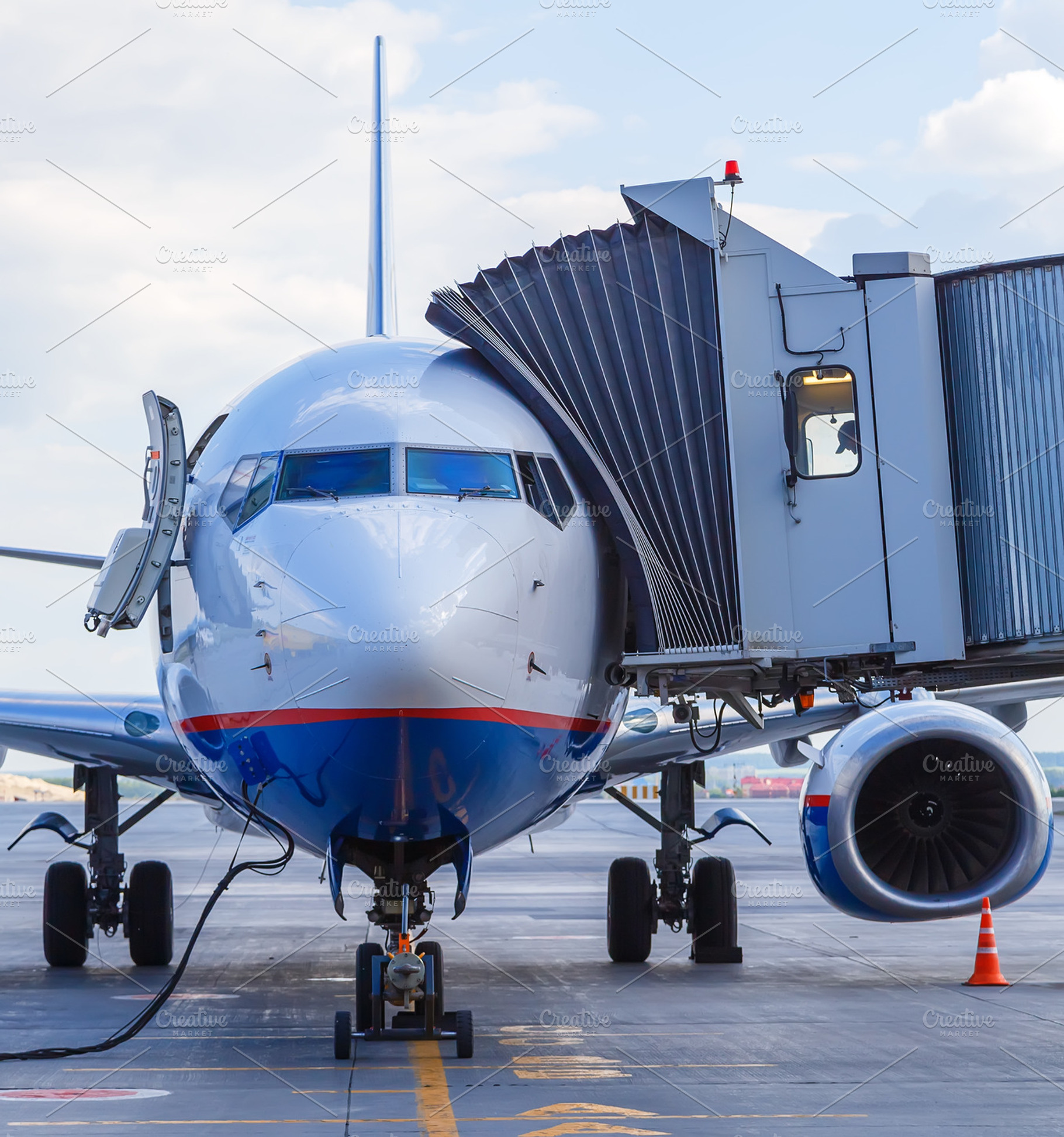 Commercial airplane parked at the airport featuring business, person, and, a Transportation Photo by VLADIMIRCARIBB