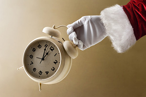 Santa Claus showing countdown with clock on New Year's Eve, a Holiday Photo by Davizro's Market