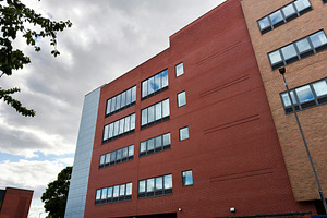 Modern brick office building with large windows in Manchester, U