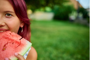 Teen girl enjoying a juicy slice of, a Nature Photo by IlliaBondarPhotography