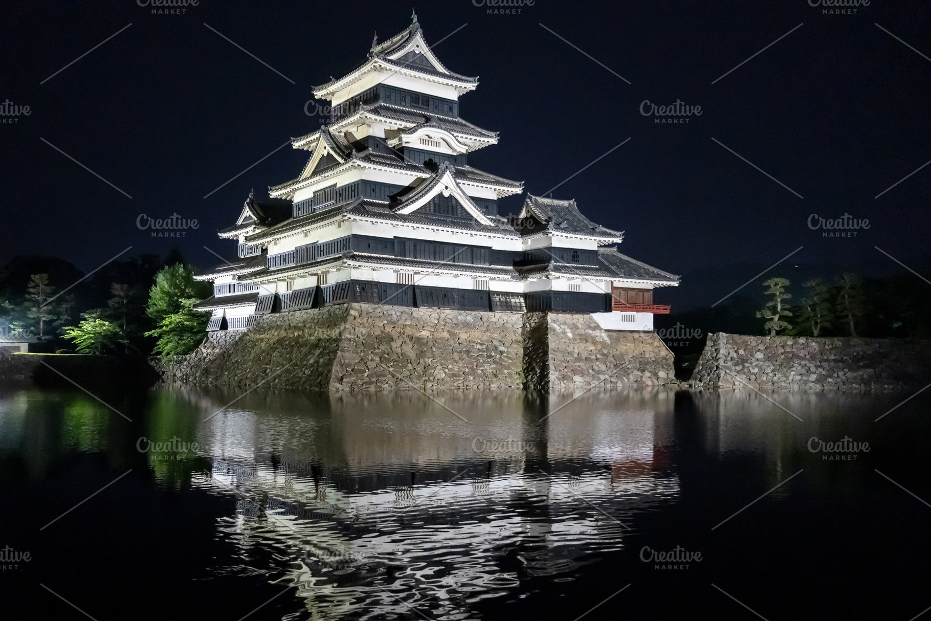 Night view of Matsumoto Castle reflecting in the water, Japan, an Architecture Photo by GoodGoods