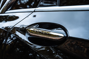 Car Door Handle Close Up with Glossy Reflection, a Transportation Photo by Red Hot Chili Pepper Shop