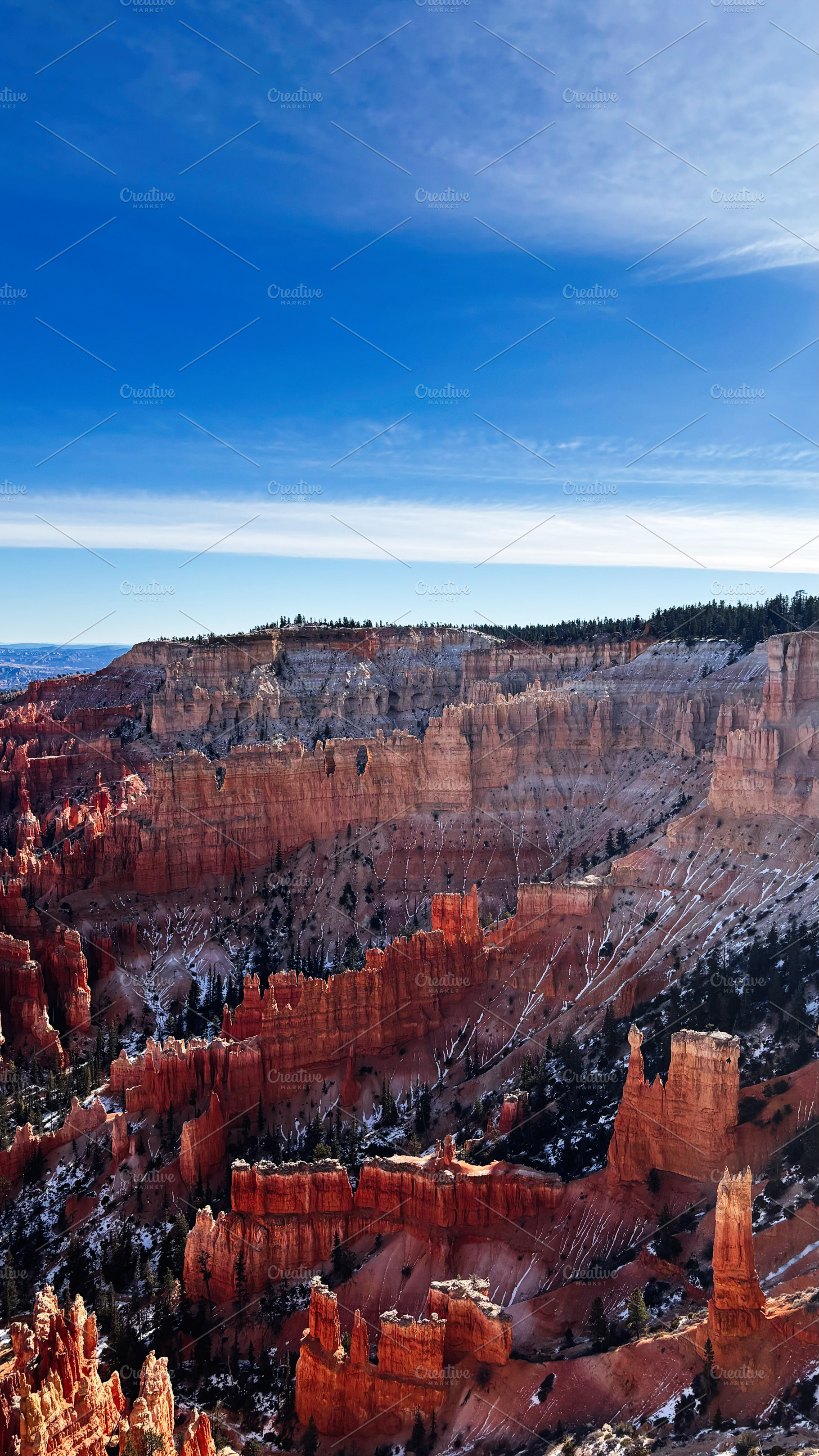 Stunning red hoodoo canyon in Utah with blue sky and snow-dusted formations, a Nature Photo by AS photostudio