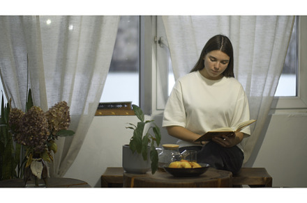 Young female student reads book in, a School & Education Photo by Media Whale Stock