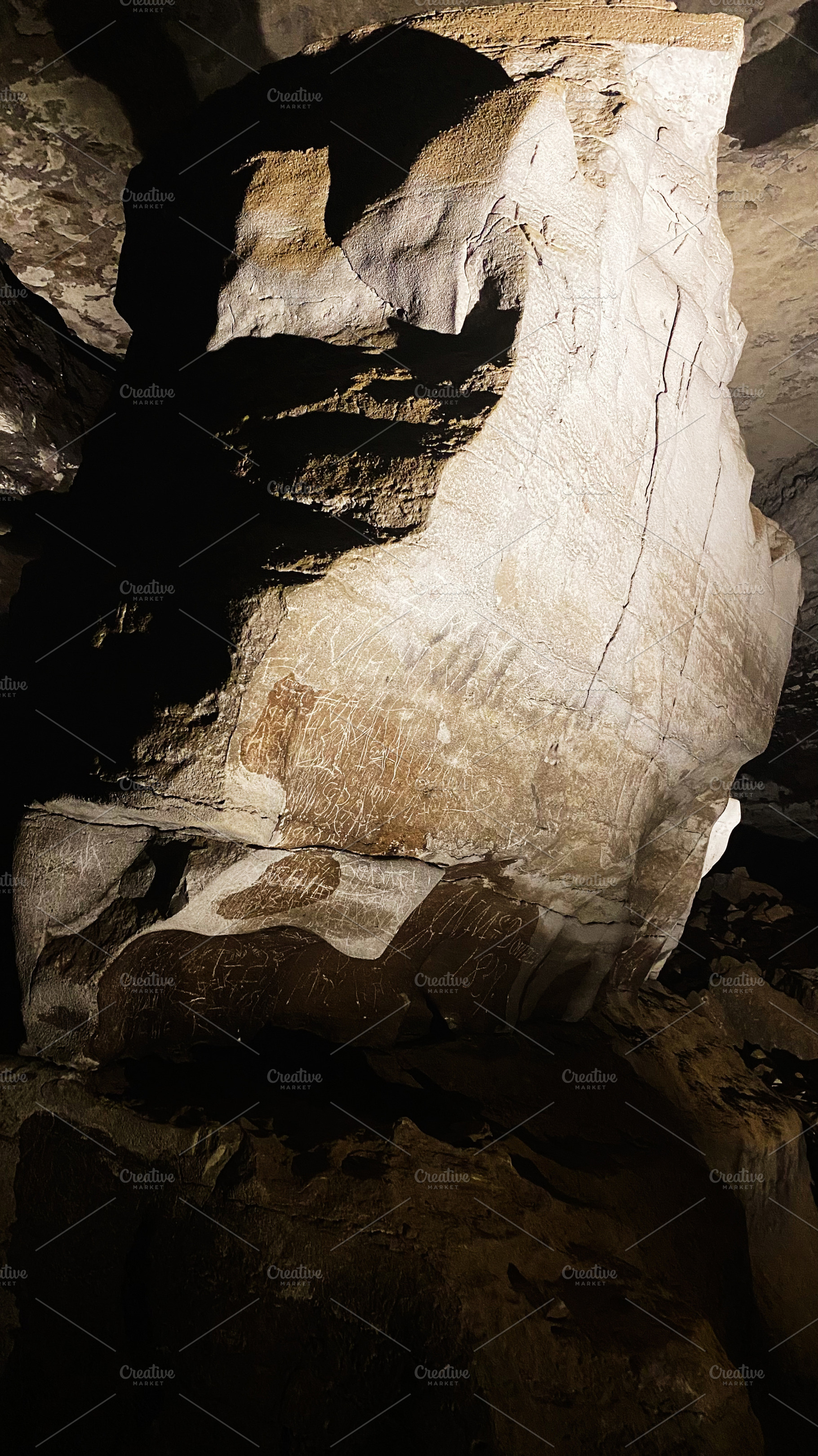Mammoth Cave Kentucky USA rock carvings inside a dark cavern with etched inscri, a Nature Photo by AS photostudio