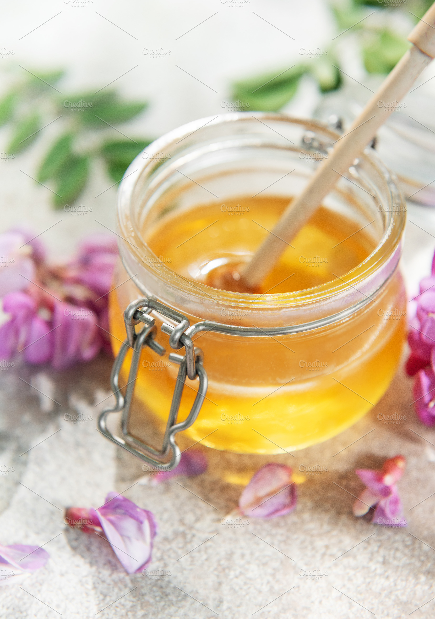 Honey and honey dipper with acacia flowers, a Food & Drink Photo by Olena Rudo