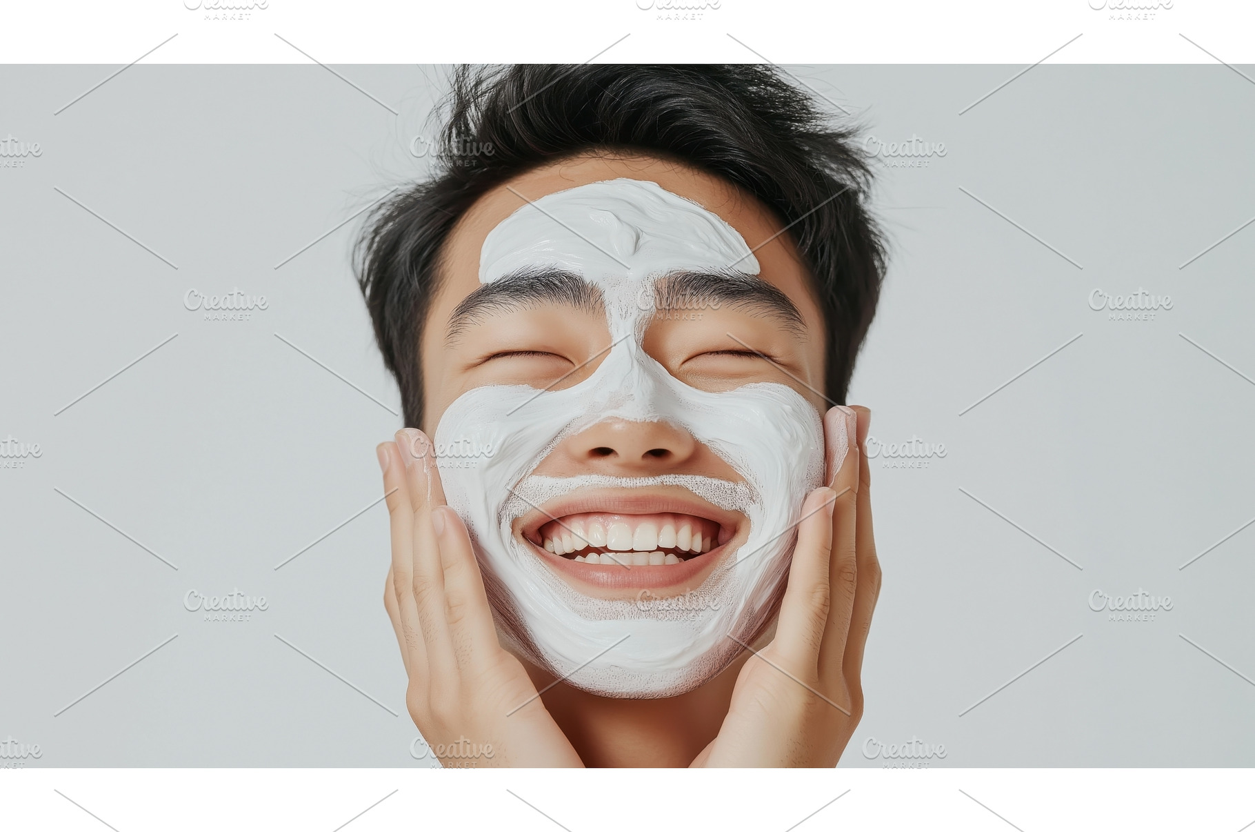 Smiling Asian man applies a white, a Person Photo by Sergey Kotenev