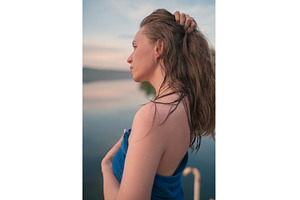 Young Woman in Towel by a Tranquil, a Person Photo by Jan Jack Russo Media