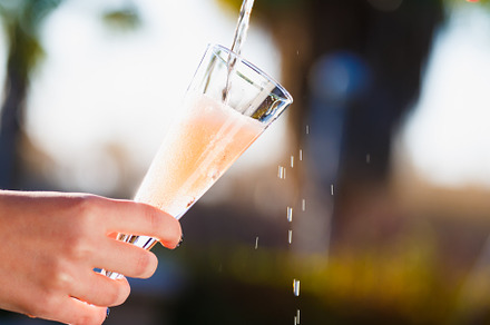 Waiter is pourring sparkling wine in, a Food & Drink Photo by Kate Molchanova