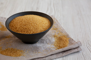 Organic Demerara Sugar in a Bowl, side view., a Food & Drink Photo by LiudmylaChuhunova