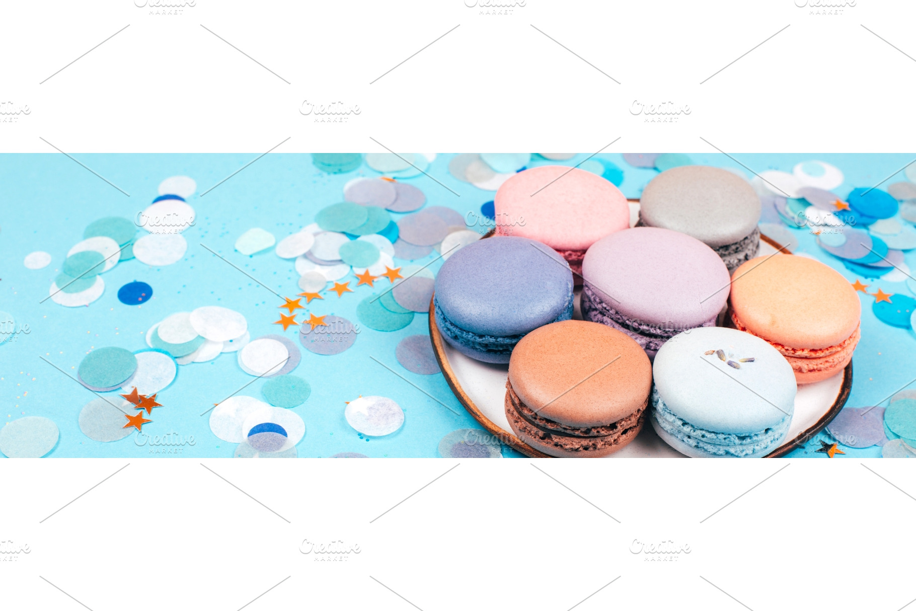 Plate of pastel macarons with, a Food & Drink Photo by Anna Efetova