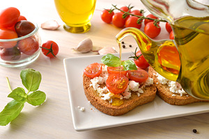 Olive Oil Drizzled Over Tomato Feta Toast, a Food & Drink Photo by Davizro's Market