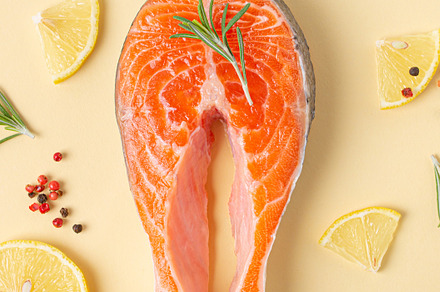 Raw fresh fish salmon steak top view on beige pastel background, a Food & Drink Photo by its_al_dente
