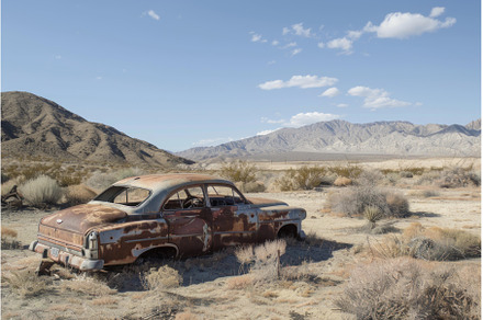 Abandoned car in desert landscape, a Transportation Photo by Ylivdesign