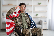 Patriotic veteran sitting in wheelchair with flag of the US, a Photo by Prostock-Studio (Thumbnail 4 of 4)