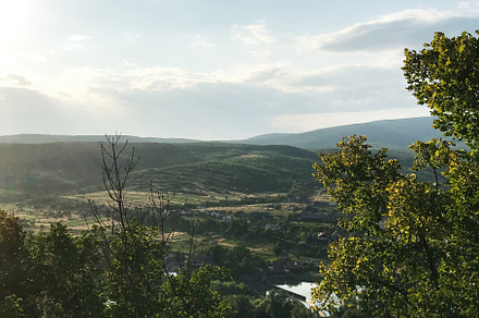 Scenic countryside landscape with rolling hills and lush greenery, a Photo by AS photostudio