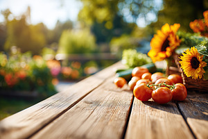 Garden table filled with freshly picked vegetables and sunflowers during a sunn, a Food & Drink Photo by AlyaAnd