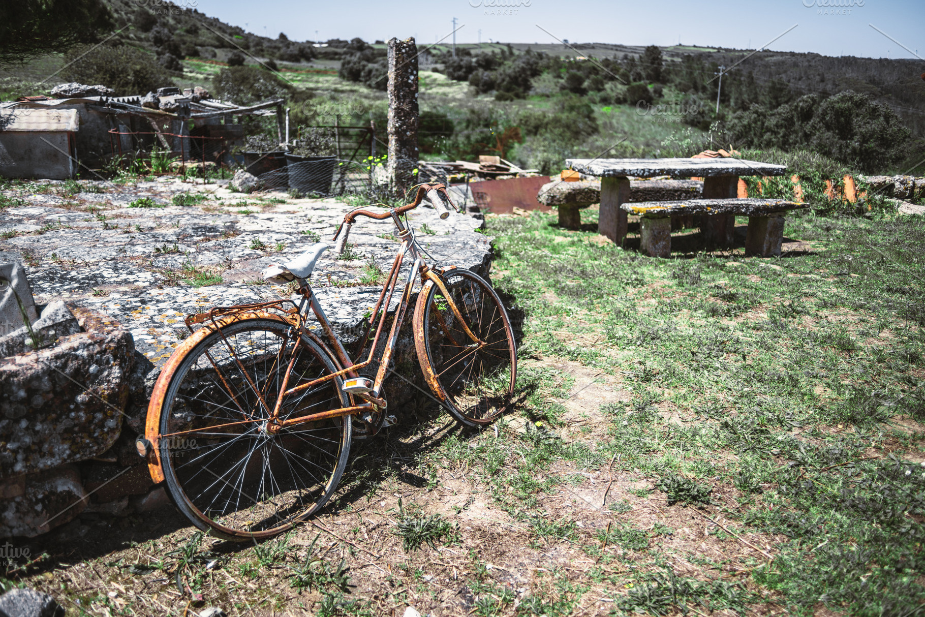 Rusty bike in countryside scene, a Transportation Photo by SkyNext