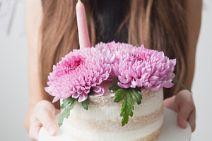 White cake with pink chrysanthemum