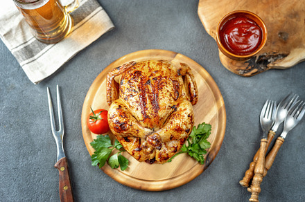 Top view of roasted chicken on rusti containing chicken, food, and baked, a Food & Drink Photo by Yummypic