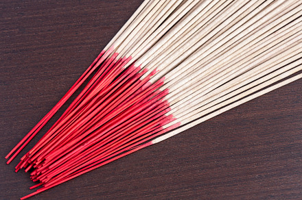 Incense aromatic sticks on wooden background, an Abstract Photo by Artsaba Family