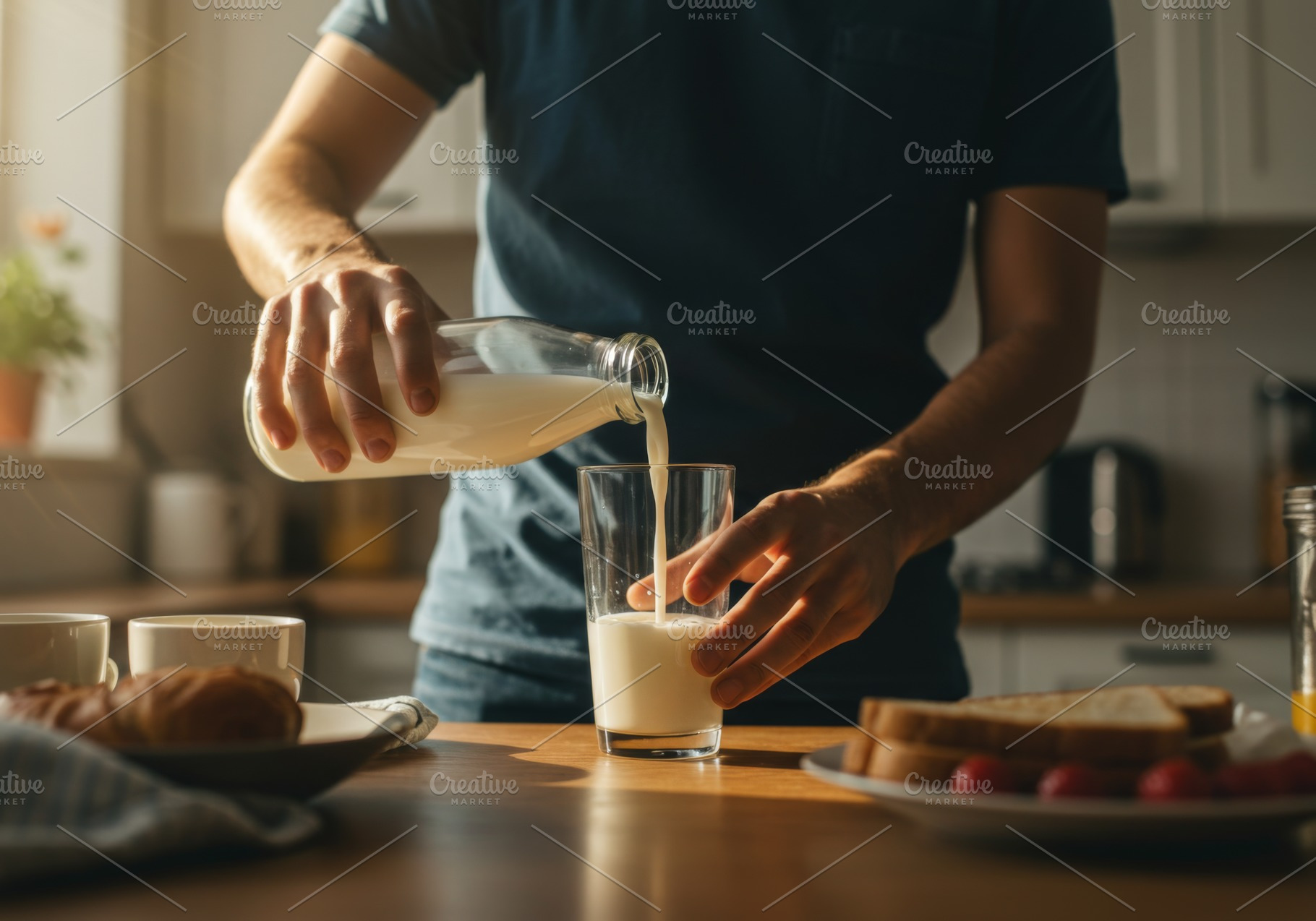 Man pouring fresh milk into a glass, a Food & Drink Photo by professorinc