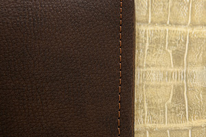 Detail of brown leather cover with stitching on textured background, an Abstract Photo by Antonio Gravante Market