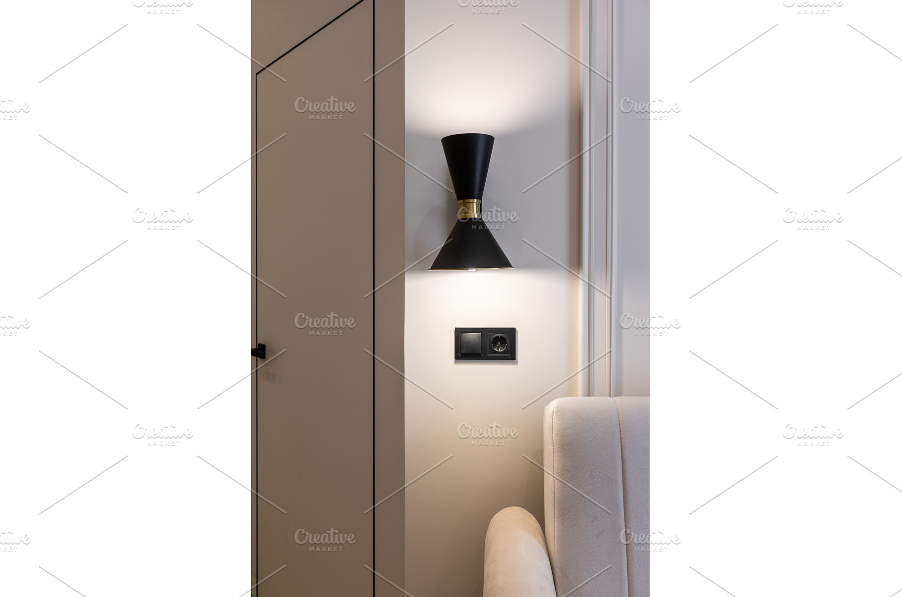Black wall sconce above modern sofa, an Architecture Photo by wip3out