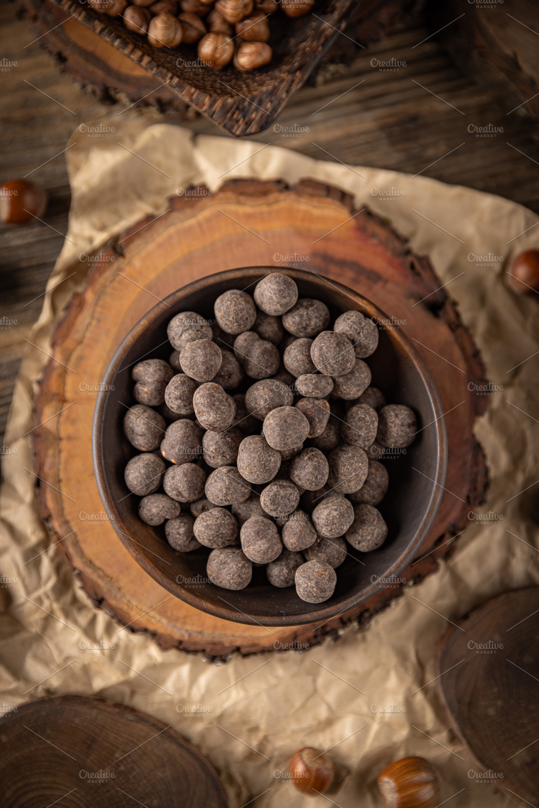 Roasted hazelnuts covered with chocolate, a Photo by Grafvision photography