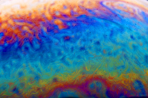 Vivid abstract background with swirling blue, orange, and yellow, a Background Photo by Ales Munt