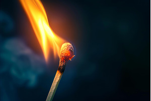 Ignited matchstick on a dark, an Abstract Photo by Ylivdesign