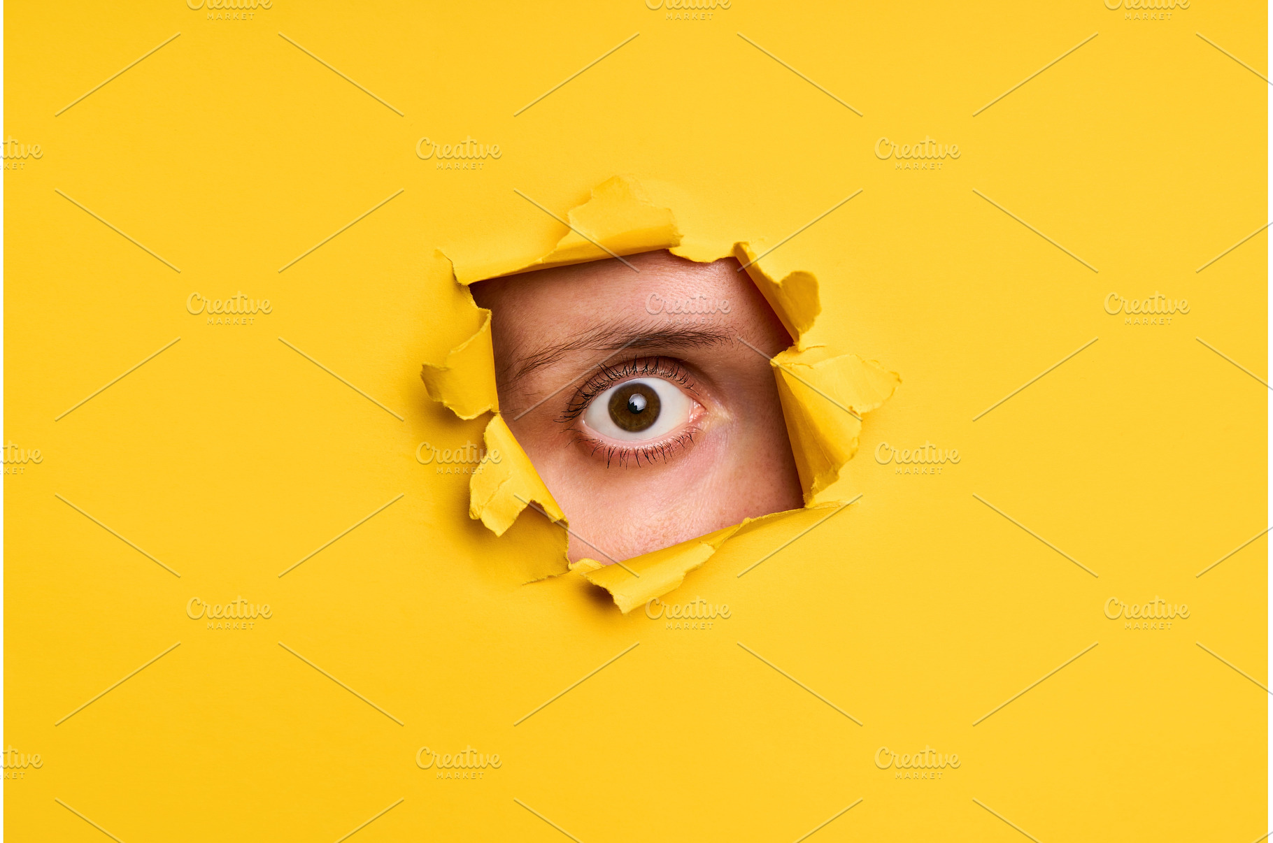 Human eye looking through torn, a Background Photo by Gladkov photography