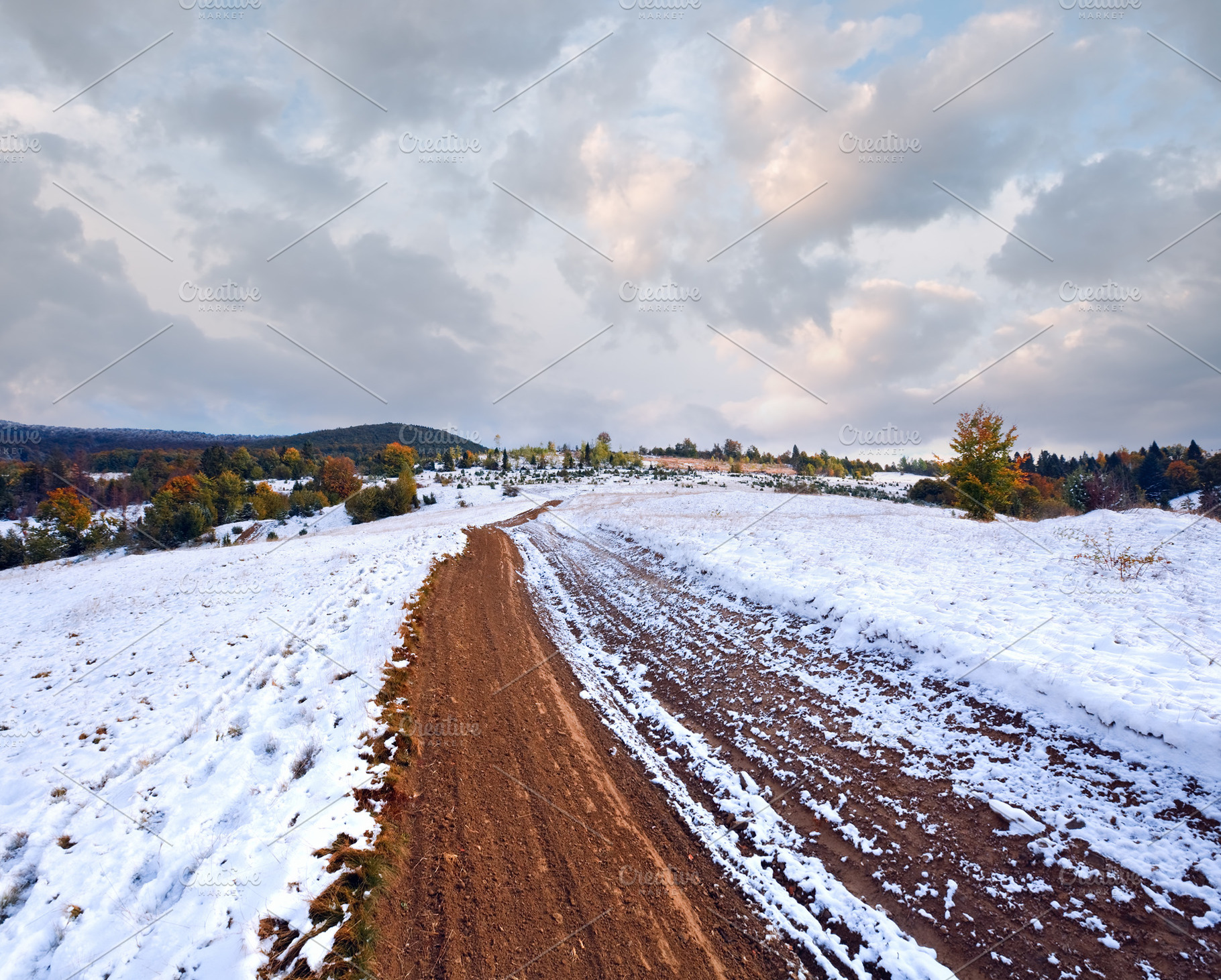 First winter snow on autumn mountain dirty road, a Nature Photo by YuriyB