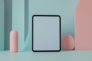 Blank tablet screen displayed on a pastel grey and colorful abstract background, a Technology Photo by AlyaAnd