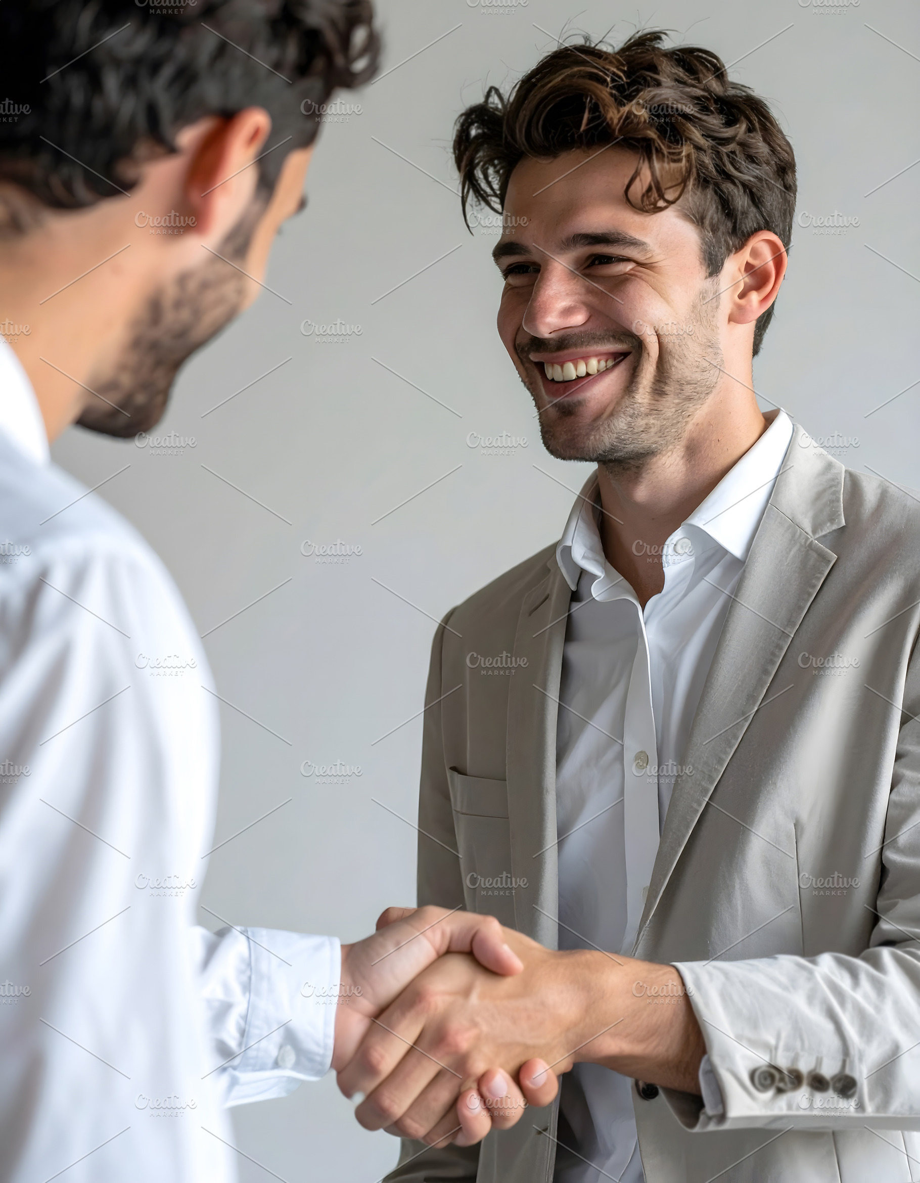 Businessman smiling handshake symbolizing trust and corporate un, a Person Photo by GoodGoods