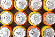 Pattern of orange and yellow drink cans top view, a Food & Drink Photo by Davizro's Market (Thumbnail 2 of 2)