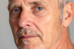 Mature senior man with piercing blue eyes and beard, a Person Photo by GoodGoods