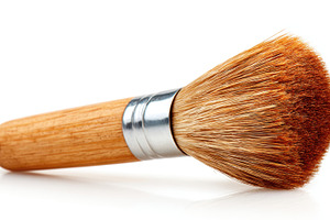 Close-up of a makeup brush with wooden handle, an Abstract Photo by AlyaAnd