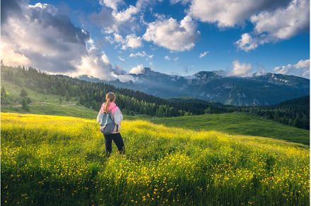 Girl on the hill with yellow flowers, a Person Photo by den-belitsky