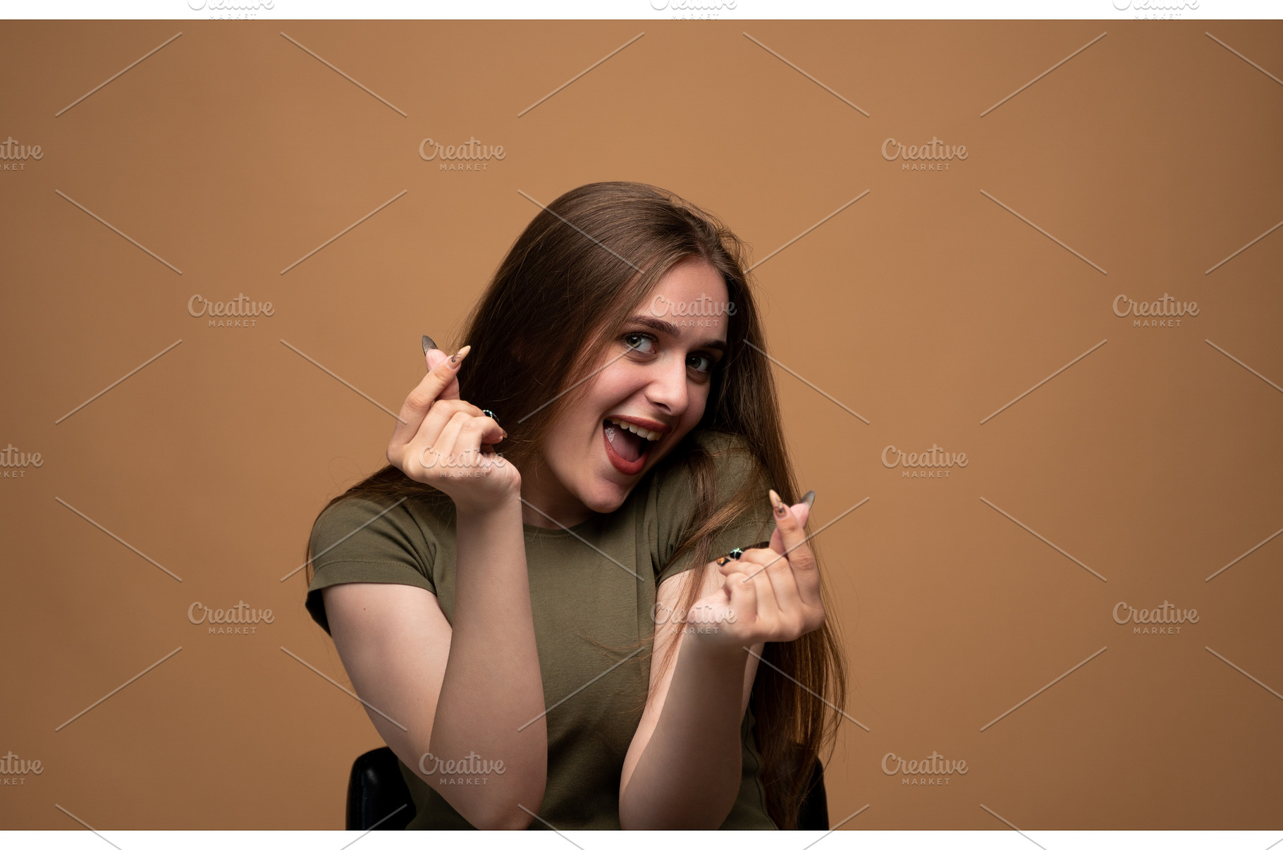 Young woman making a Korean finger, a Person Photo by volodymyrshtun13795
