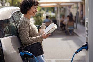 Woman electric vehicle eco-friendly, a Person Photo by Shootdiem