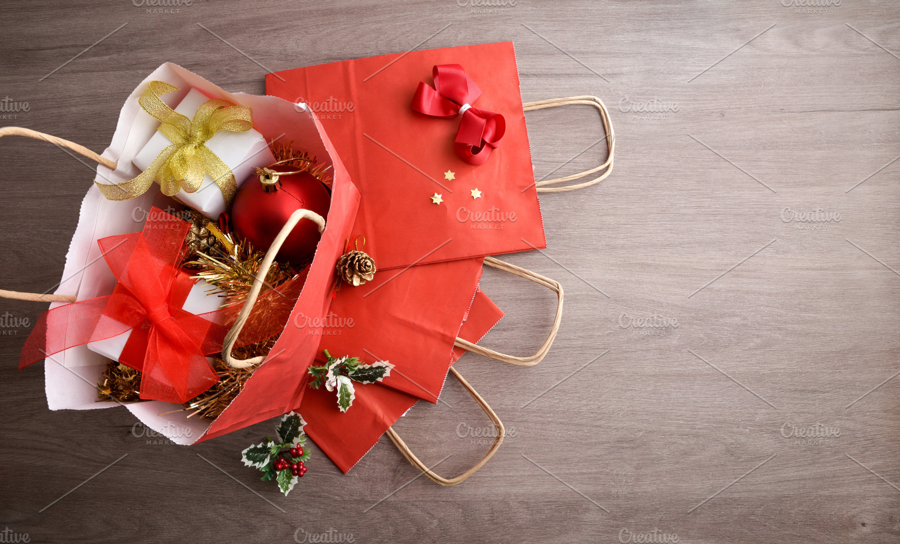 Concept of buying Christmas gifts and decorations with red bags, a Holiday Photo by Davizro's Market