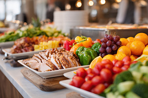Buffet table with sliced roast beef and fresh fruit, a Food & Drink Photo by AlyaAnd