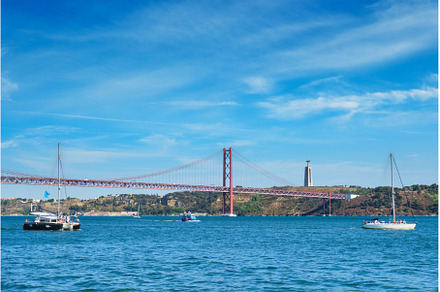 View of 25 de Abril Bridge over, a Transportation Photo by f9photos