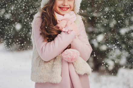 Little happy beautiful girl in stock photo containing winter and snow