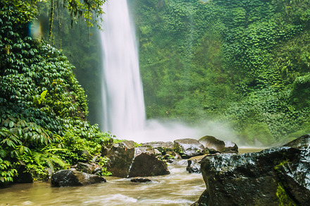 Amazing nungnung waterfall rocks and some waterdrops bali indonesia stock, a Holiday Photo by Igor Tichonow