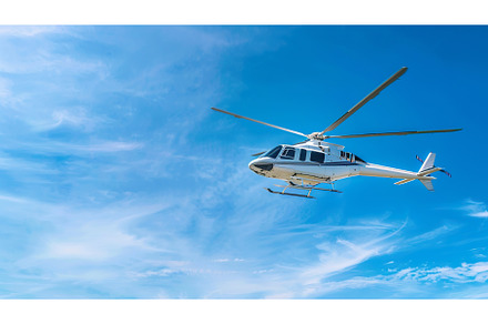 A white helicopter flies gracefully, a Transportation Photo by Lermont51
