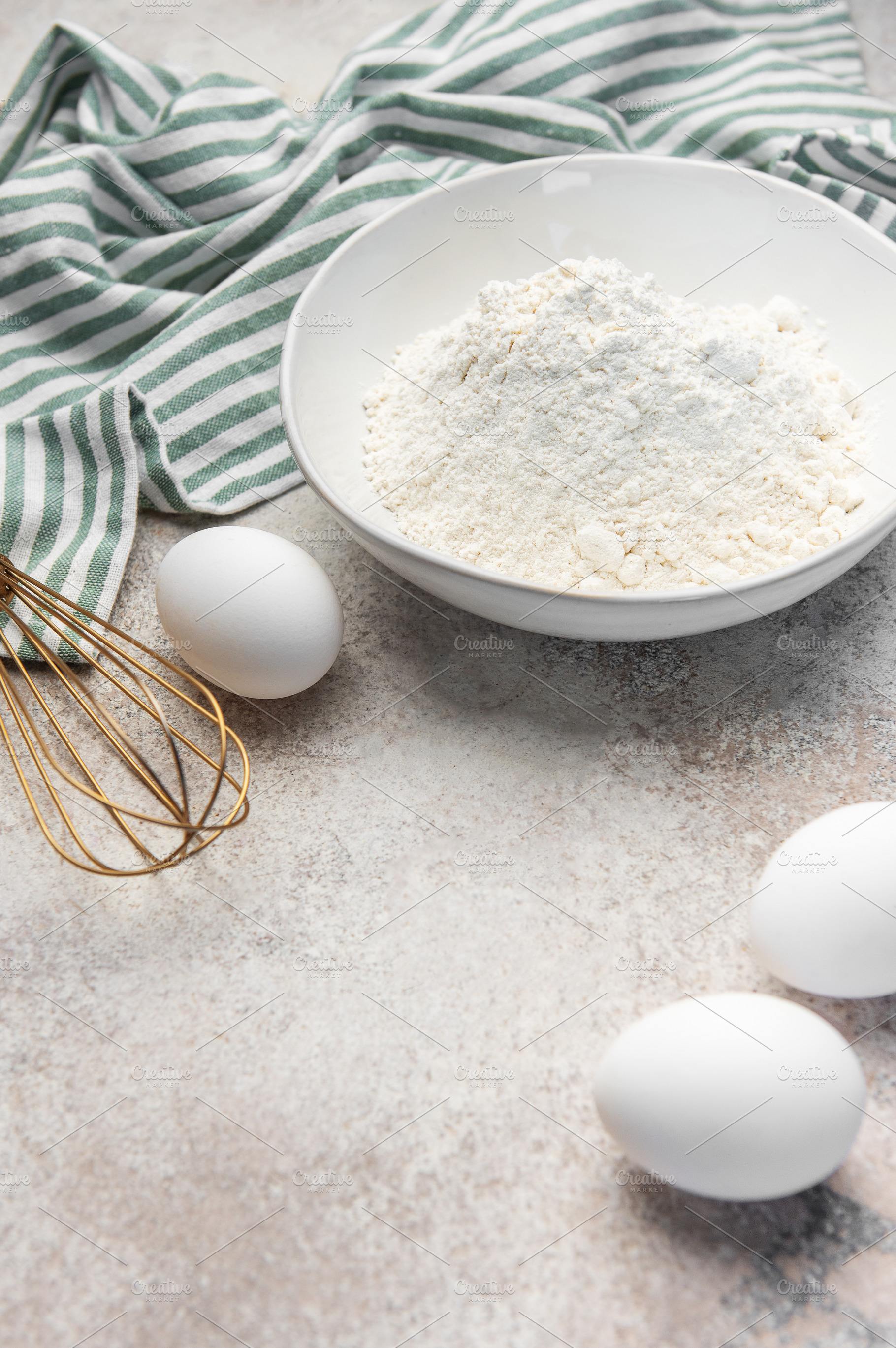 Baking ingredients on counter preparing dough, a Food & Drink Photo by Olena Rudo