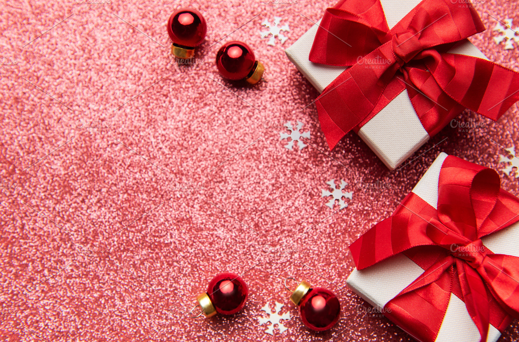 Christmas gifts decorating a red glitter background, a Holiday Photo by Olena Rudo